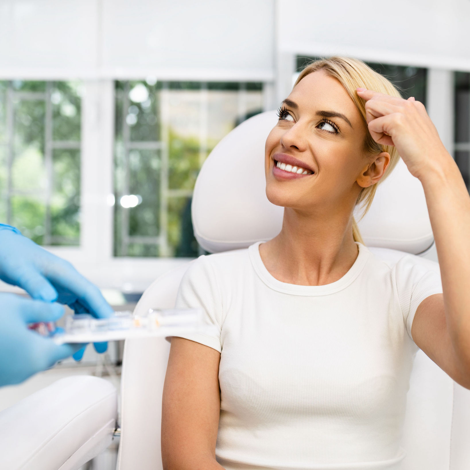 A woman at a beautician's office is ready for a procedure