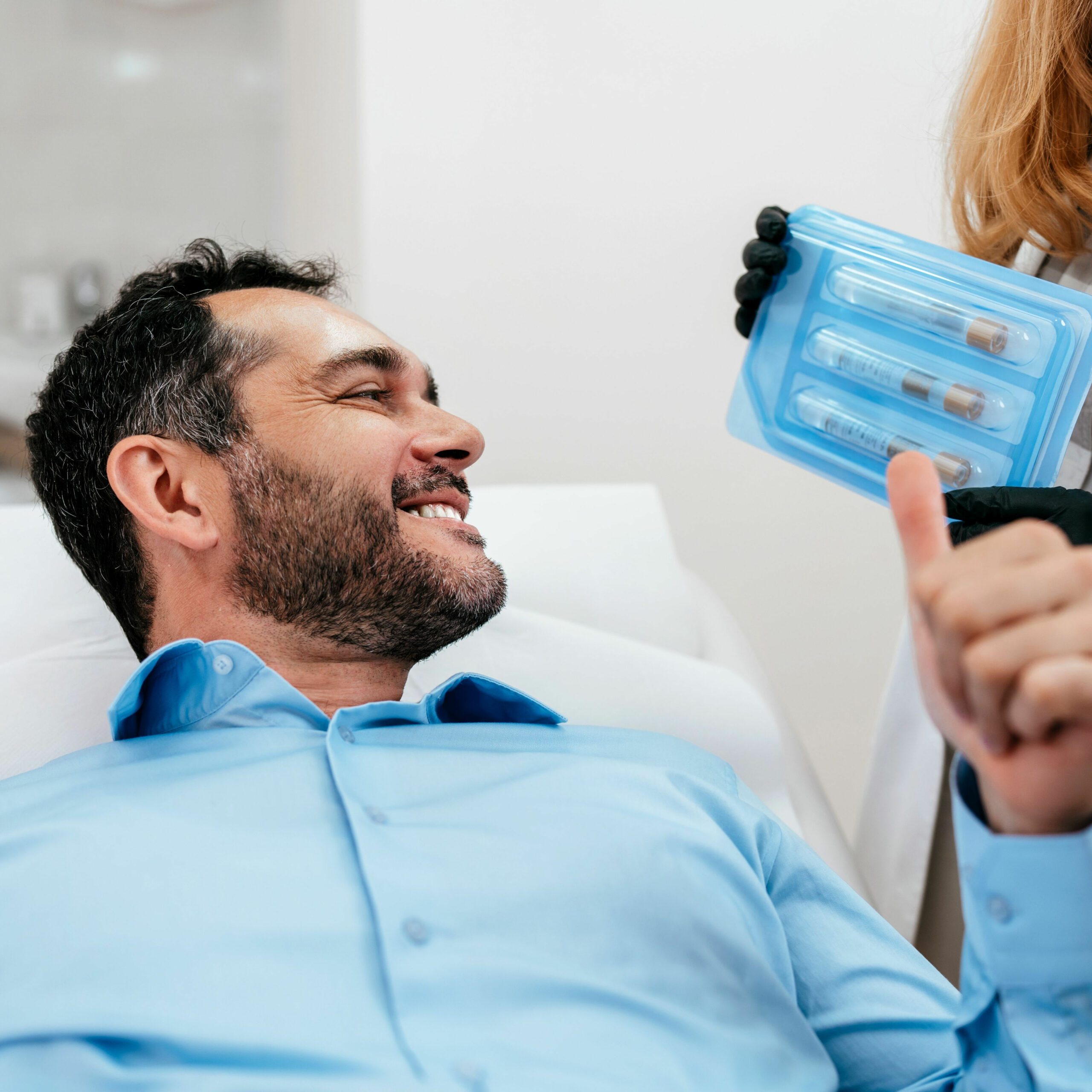 Middle aged man is excited to receive his PRP treatment