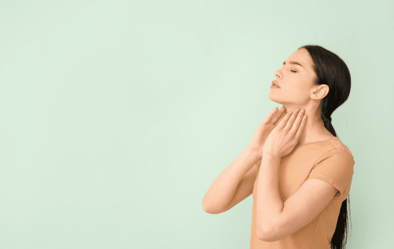woman self-checking thyroid health